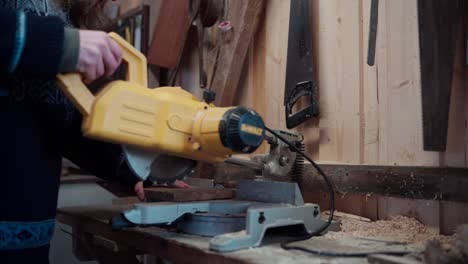 The-Man-is-Cutting-a-Wooden-Plank-with-a-Circular-Saw-for-the-Construction-of-a-DIY-Hot-Tub---Close-Up