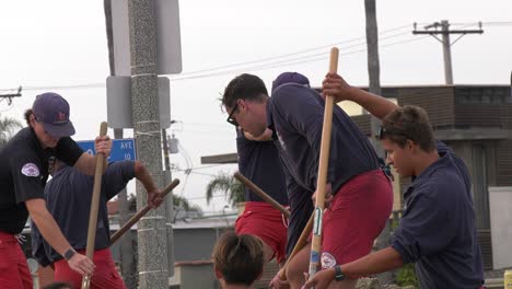 lifeguards-scoop-sand-into-sand-bags