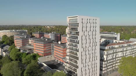 Aerial-shot-of-mixed-use-development-with-office-buildings-and-urban-modernistic-high-rise