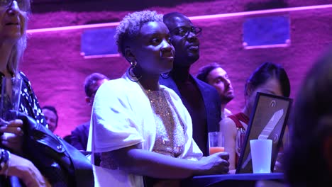 Slow-motion-shot-of-an-african-american-couple-listening-to-a-presentation