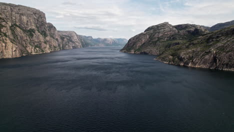 Aerial-shot,-panning-over-the-wide,-windswept-waters-of-Lysefjord,-Norway