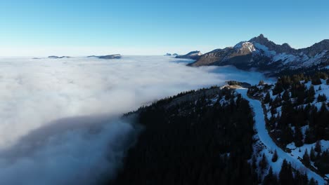 Sea-of-clouds-on-beautiful-mountain's-summit-in-morning-with-ski-station-lift