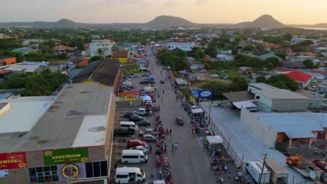Drone-orbits-throngs-of-people-waiting-to-party-with-Carnaval-Grand-March-at-sunset