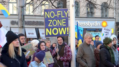 People-with-signs-and-flags-at-Swedish-rally-against-war-in-Ukraine