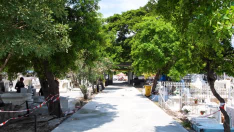 View-of-pathway-and-front-gates-in-historic-site-of-Santa-Cruz-cemetery-in-capital-city-of-East-Timor,-Southeast-Asia