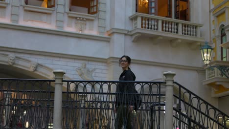 Woman-Walking-On-Stairs-To-Cross-The-Bridge-At-The-Venetian-Las-Vegas-In-Nevada,-USA