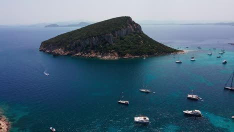 Savor-the-charm-of-Spiaggia-di-Cala-Moresca,-where-pristine-sands-meet-azure-waters-in-a-tranquil-coastal-oasis