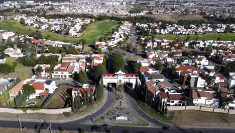 Driving-cars-on-highway-and-town-gate-of-Puebla-City