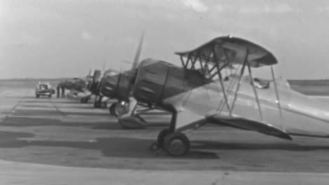 Biplanes-Parked-on-a-Platform-at-Roosevelt-Field-Airport-in-New-York-1930s