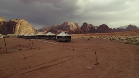 Camping-Huts-for-Tourists-in-Wadi-Rum-Jordanian-Desert,-Aerial-Drone-View