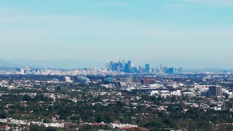 Drone-aerial-shot-of-the-los-angeles-skyline-in-california-on-sunny-day