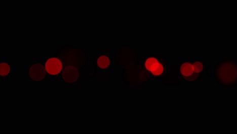 Animation-of-strip-of-red-scarlet-bokeh-lights-with-subtle-ring