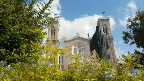 Cathedral-Church-of-Athens-Greece-and-Archbishop-Damaskinos-Statue-on-Sunny-Summer-Day