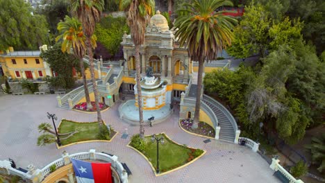 Famous-Historic-Old-Cultural-Neptune-Fountain-On-Santa-Lucia-Hill,-Santiago-Chile-Chiloe-4K-Drone-Flyover