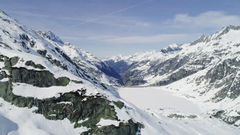 Aerial-of-a-dam-in-winter