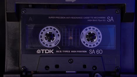 Audio-Cassette-Tape-Playback-in-Vintage-1980's-Player,-Static-Close-Up-4k