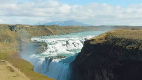 4K-drone,-aerial-cinematic,-landscape,-and-panoramic-view-of-an-iconic-waterfall-near-Kirkjufell