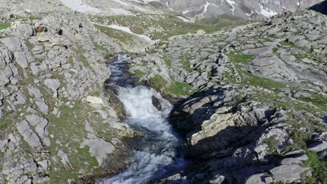 Mountain-stream-cascading-over-rocks-in-Stroppia,-near-Lago-Niera