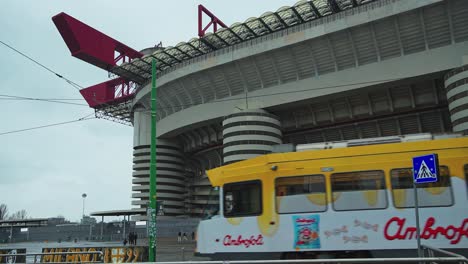 Outside-the-San-Siro-Stadium-Milan,-visitors-commute-by-tram-and-foot
