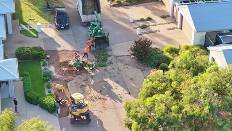 Yarrawonga,-Victoria,-Australia---6-March-2024:-Tree-workers-clearing-up-after-felling-a-tree-and-preparing-for-stump-grinding-in-a-suburban-street