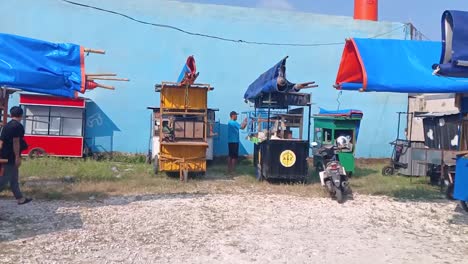 Street-vendor-cart-bases-line-the-city-of-Blora,-Central-Java,-Indonesia