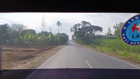 Pov-inside-a-bus-driving-in-Central-Java,-Indonesia