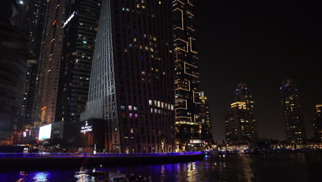 Dubai-UAE,-Shiny-Skyscrapers-and-Light-Above-Canal-in-Dubai-Marina-at-Night