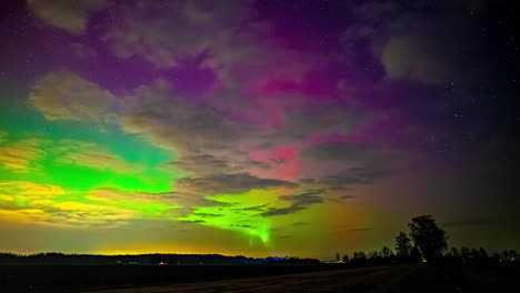 Time-lapse-shot-of-a-colorful-Aurora-Borealis-night-sky-above-the-countryside