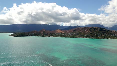 Scenic-Mountains-And-Ocean-Against-Cloudy-Blue-Sky-In-Oahu-Island,-Hawaii---Aerial-Drone-Shot