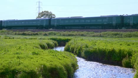 GWR-Express-train-passing-over-a-stream-near-Tiverton-Parkway-Station-travelling-North-out-of-the-city-of-Exeter