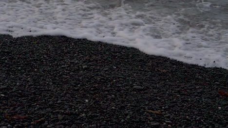 Slow-Motion-Waves-on-a-Black-Pebble-Beach-at-Dusk---Kaikoura,-New-Zealand