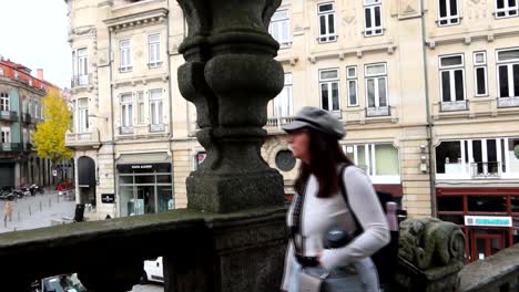 Tourist-in-Porto-observing-the-city-from-Igreja-dos-Clerigos,-slow-motion-shot