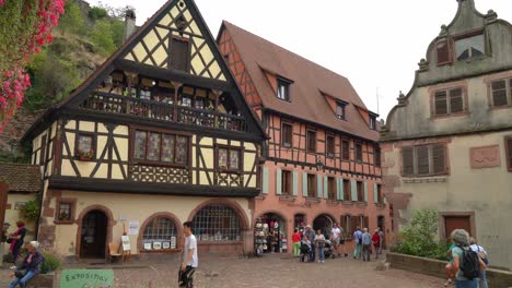 Tourists-Pass-Colourful-Half-Timbered-Houses-in-Kayserberg-Village