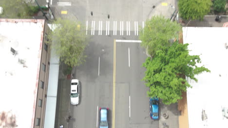 AERIAL-DRONE-SHOT-OF-BUILDINGS-AND-STREET-DOWNTOWN-TACOMA-WASHINGTON-PANNING-UPWARD