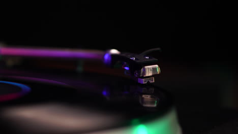 Vintage-Gramophone-With-Shure-Cartridge-on-Spinning-Vinyl-Record,-Hand-in-Back,-Taking-Glass-of-Drink,-Close-Up,-Selective-Focus,-Full-Frame