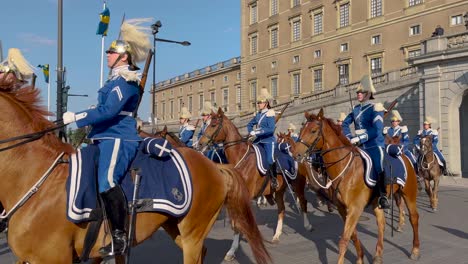 Guards-on-horses-parade-by-Swedish-Royal-Palace-on-national-day