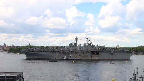 Wide-side-view-of-battleship-USS-Kearsarge-in-water-in-Sweden,-static