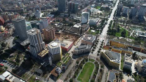 Tirana's-Boulevard-Flanked-by-Towering-Structures-Under-Construction,-Portraying-the-City's-Astounding-Development-and-Modernization