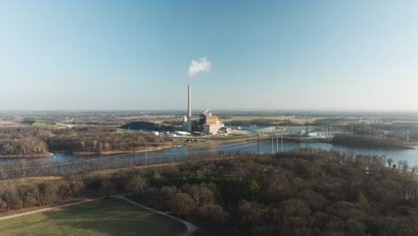 Flint-creek-power-plant-by-lake-swepco,-clear-sky,-industrial-scene,-aerial-view