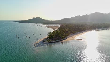 Orbit-drone-shot-of-sunset-Siwalai-beach-on-Koh-Mook-tropical-island-in-Andaman-sea-in-Trang,-southern-Thailand