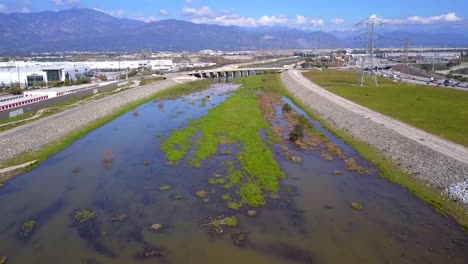 Aerial-view-facing-north-of-the-San-Gabriel-river-over-a-small-terraced-waterfall