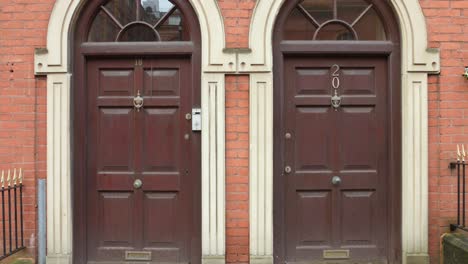 Tilt-down-shot-of-Consulate-General-of-the-Republic-of-Turkiye-Manchester-building-located-near-oxford-road-in-Manchester,-England-at-daytime