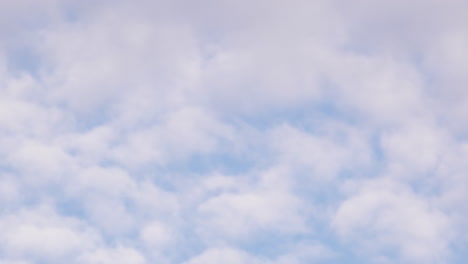 Timelapse-footage-of-fast-moving-clouds-across-blue-springtime-sky