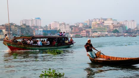 Transport-and-fishing-wooden-boats-sail-Buriganga-river,-Southeast-Asia