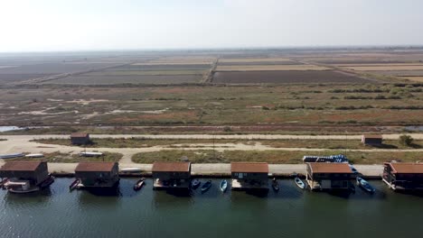 Aerial-Shot-of-Delta-Axiou-River-National-Park,-Natura-2000,-Mussel-farmers-houses