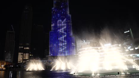 Downtown-Dubai-UAE-at-Night,-Music-Fountain-and-Illumination-on-Burj-Khalifa-Skyscraper