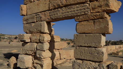 Ancient-Roman-ruins-under-clear-blue-sky-in-Sbeitla,-Tunisia,-showcasing-historical-architecture