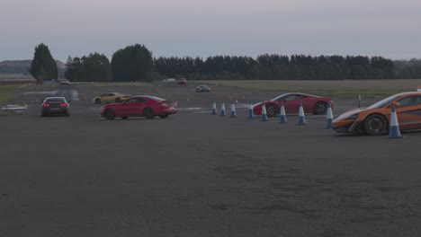 Static-shot-of-a-group-of-supercars-waiting-to-head-out-onto-the-racetrack
