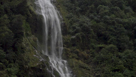 Slow-Motion-static-footage-of-a-three-pronged-waterfall-in-Doubtful-Sound---Patea,-New-Zealand