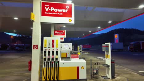 Self-service-Shell-diesel-and-petrol-fuel-pump-station-with-accessories-at-night